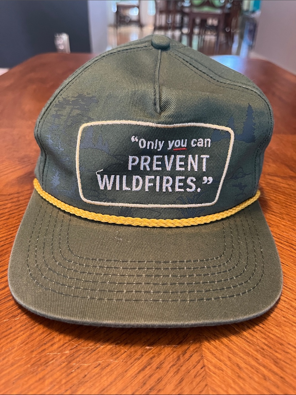 Green Rope-Accent Cap with 'Only You Can Prevent Wildfires' Slogan